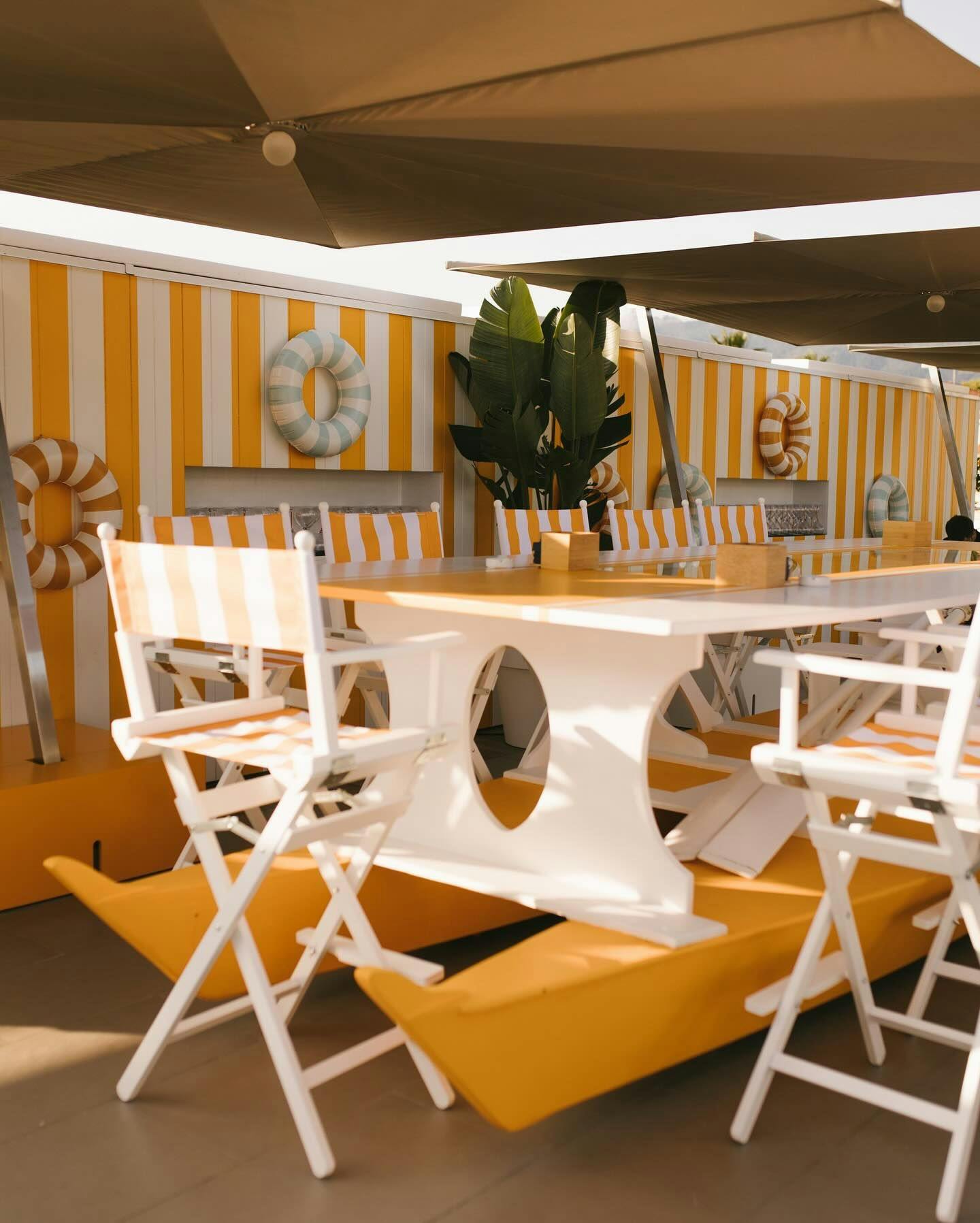 Tables and chairs in Veuve Clicquot Sun Club terrace in Pesce Terrazza in Italy.