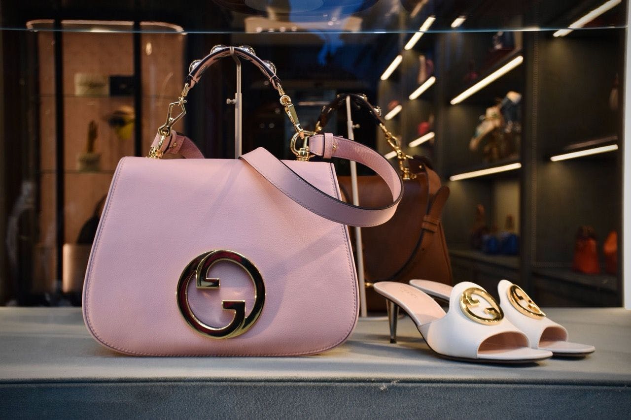 Gucci handbag and shoes on a store window display