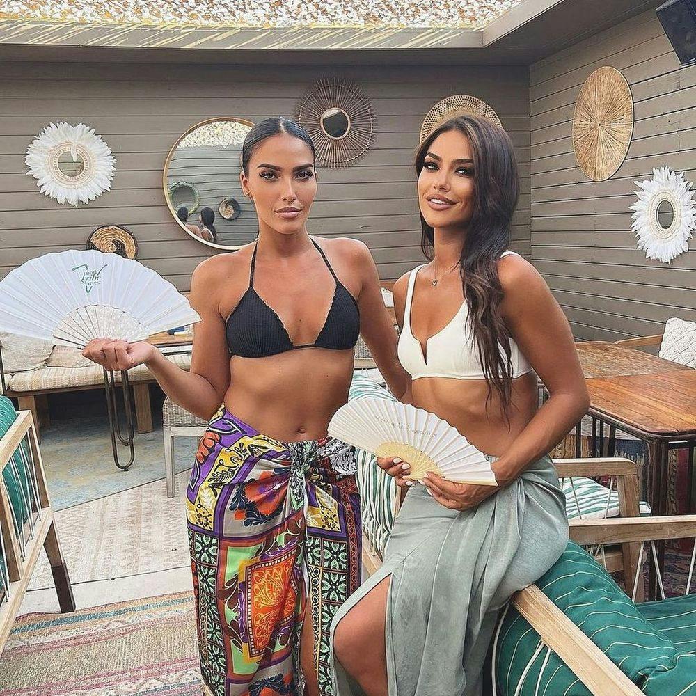 Two women standing at Saint-Tropez beach club Verde Beach