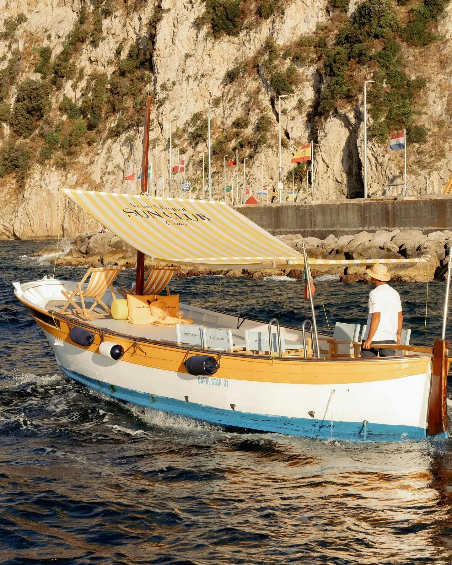 Veuve Clicquot Sun Club branded boat sailing in Capri by Gianni's Boats.