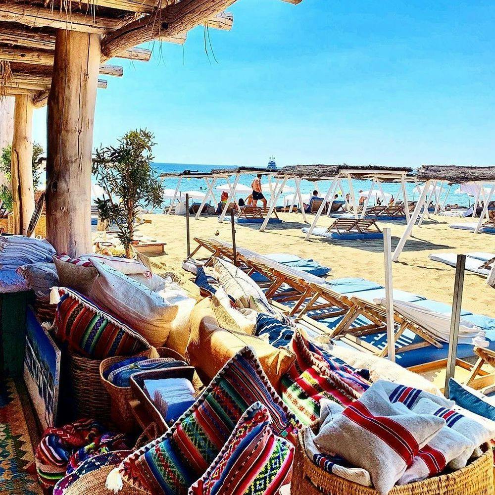 Beach with sun loungers at Saint-Tropez beach club Le Club 55