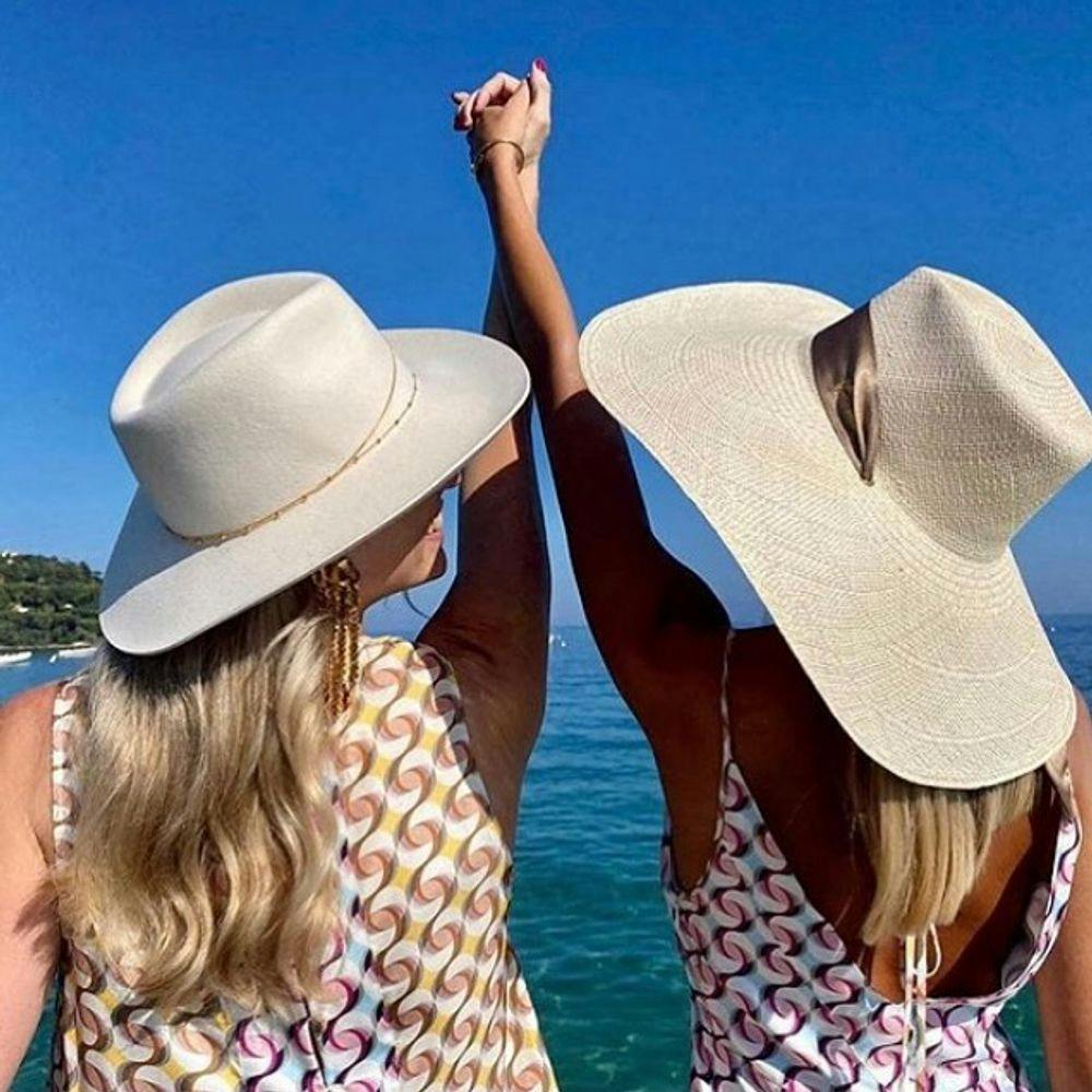 Women with straw hats in Saint-Tropez beach club Tahiti Beach