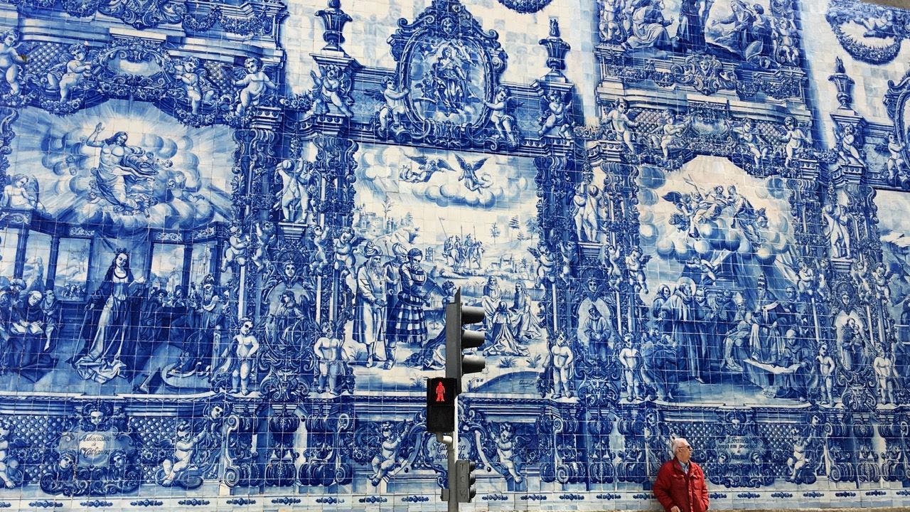 Wall covered with azulejos in Chapel of the Souls in Porto, Portugal.