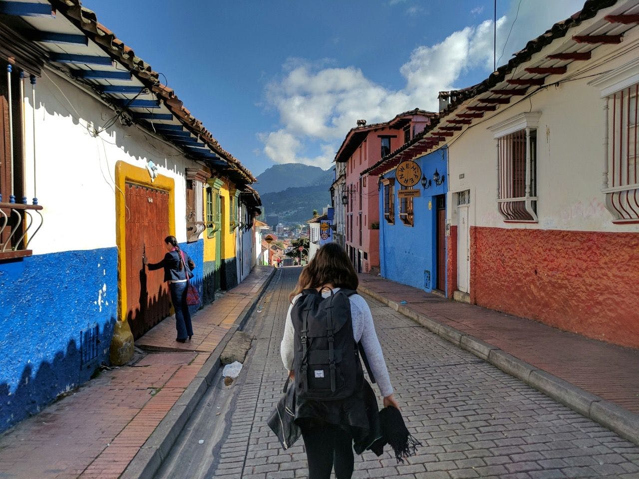 Woman walking on the street of La Candelaria in Bogotá, Colombia.