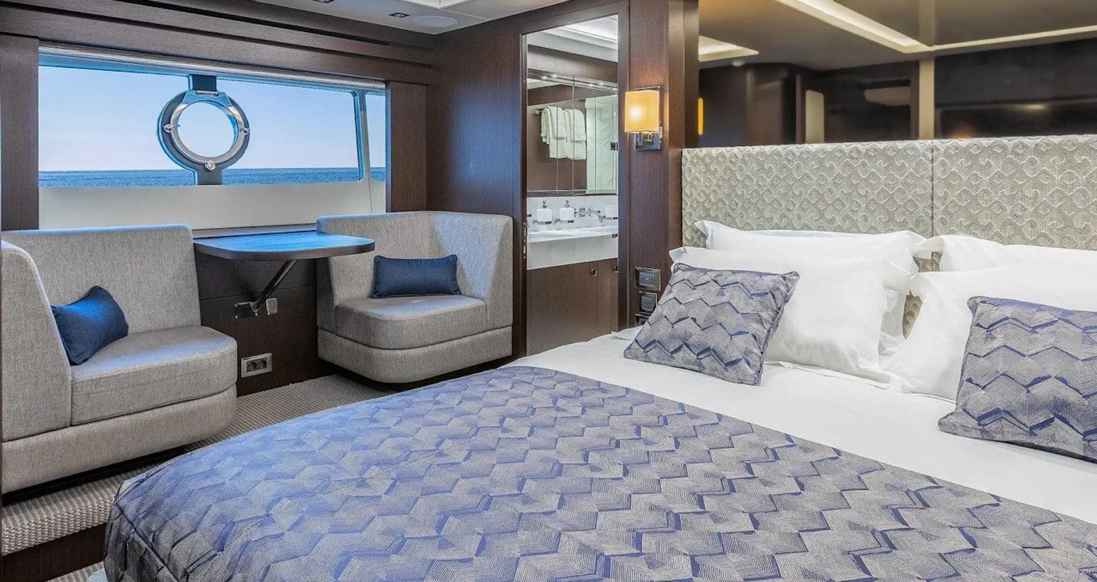 Luxurious cabin with a bed inside motor yacht.