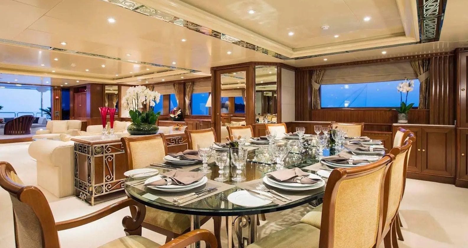 Large dining area inside a luxurious motor yacht.