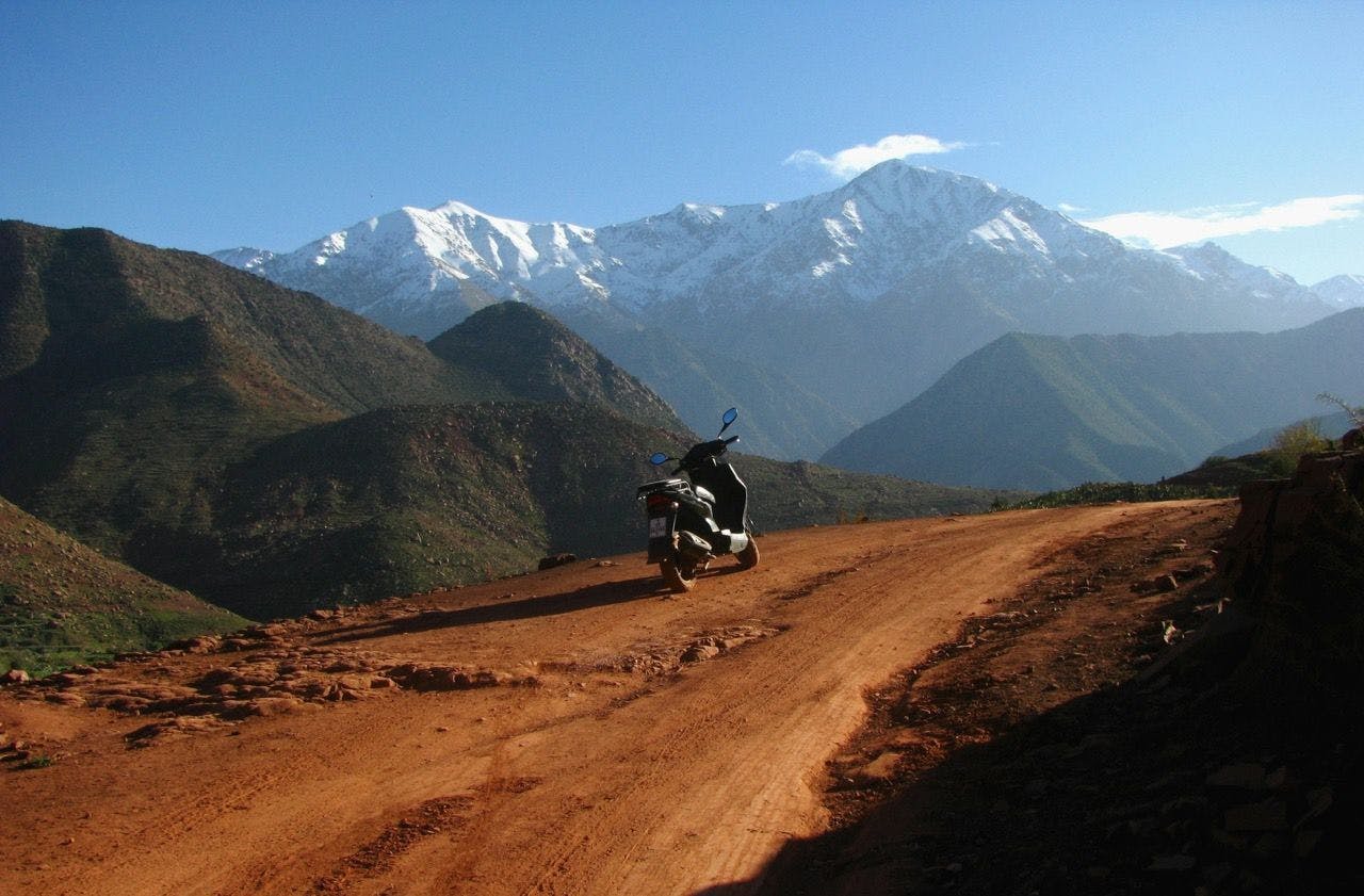 View on motorbike and Atlas Mountains in Tazitounte, Morocco.