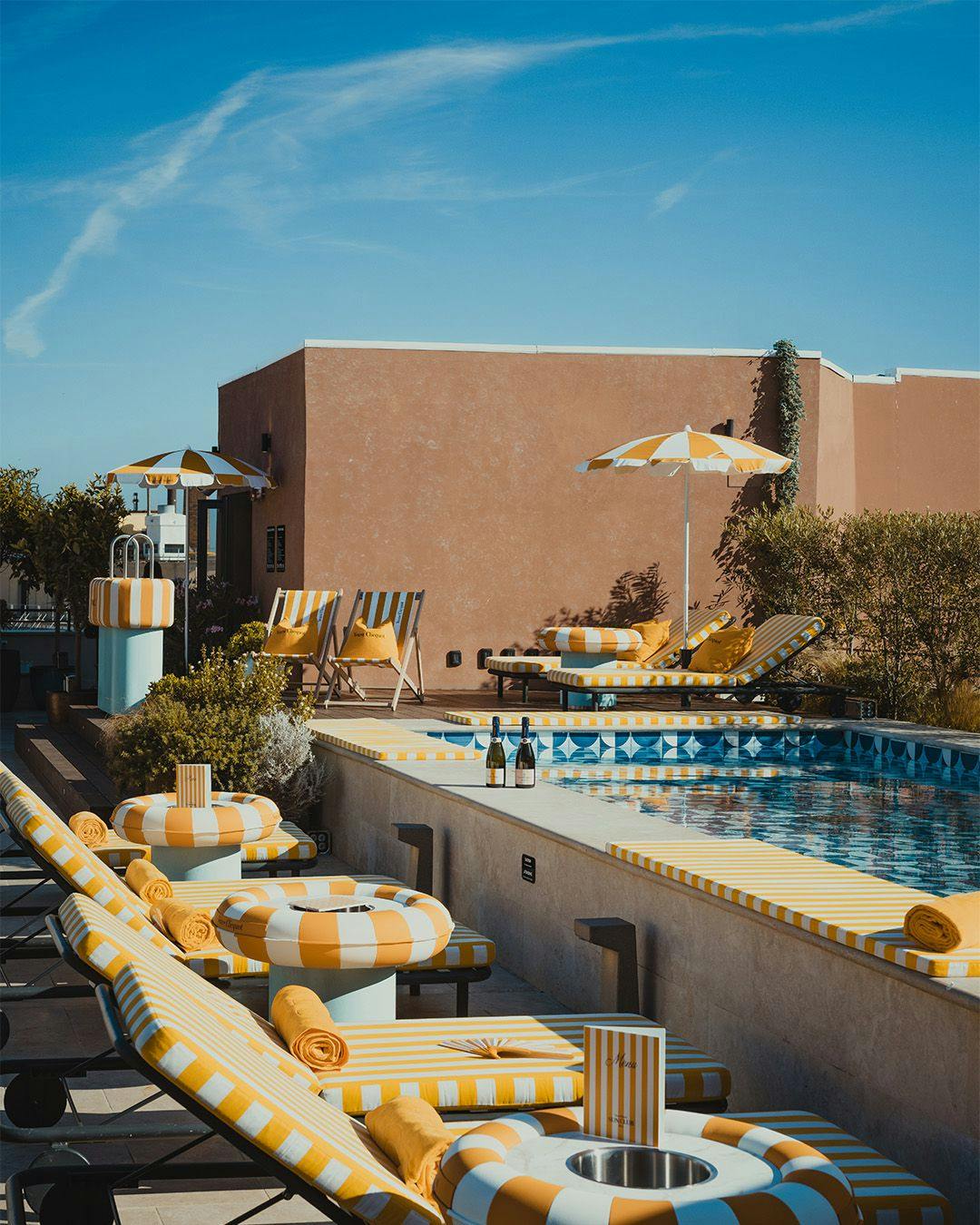 Veuve Clicquot branded pool area on the rooftop of Hotel W in Rome Italy.