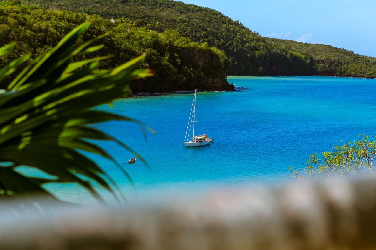 Yacht in blue Caribbean sea in Saint Lucia coastline