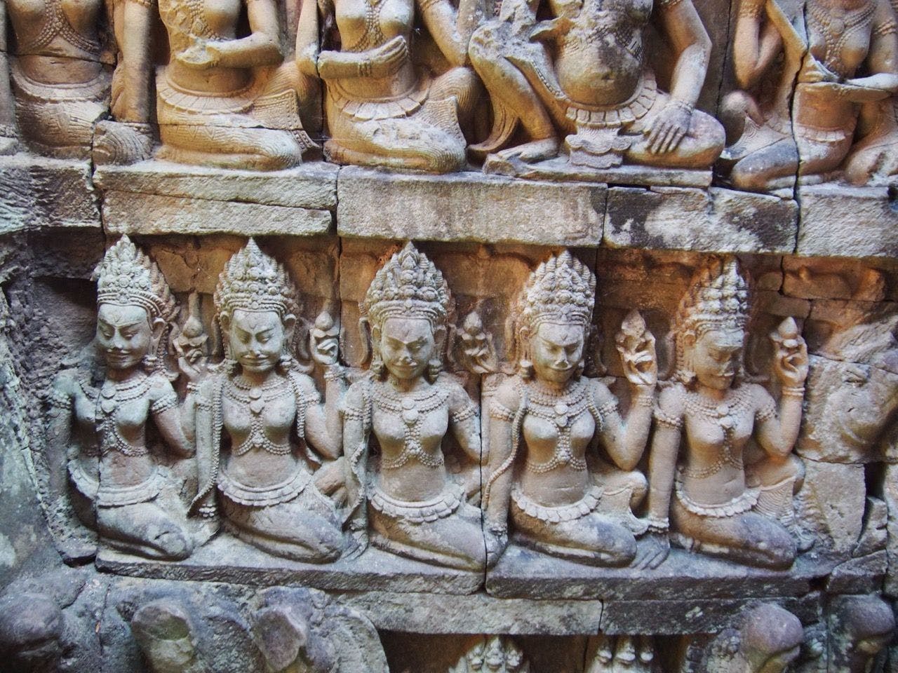 Apsara dancers carved on the wall of temple in Cambodia.