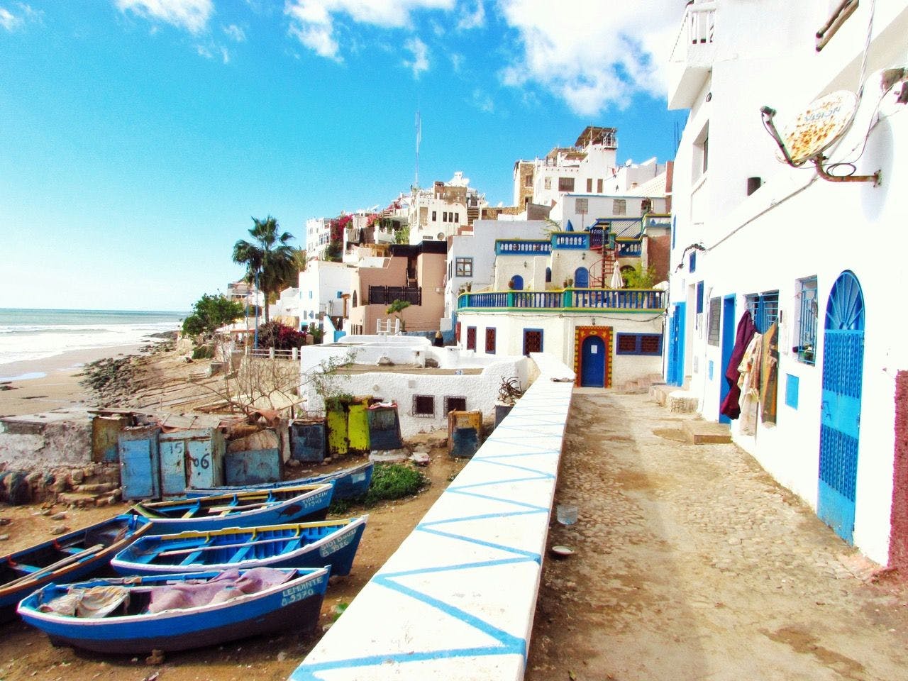 Colorful buildings and boats in Taghazout, Morocco.