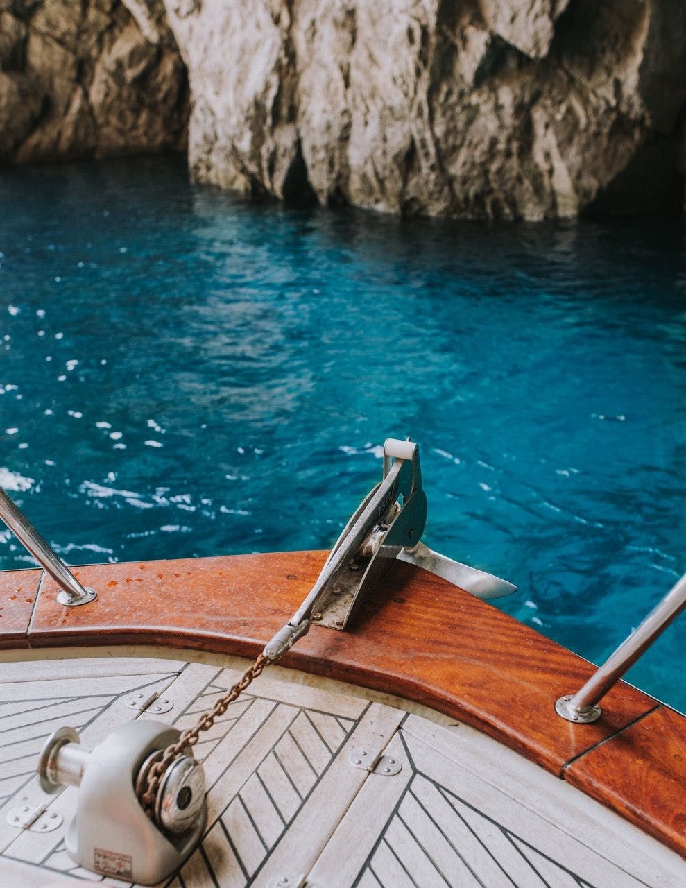 Boat sailing near Capri rocky coastline