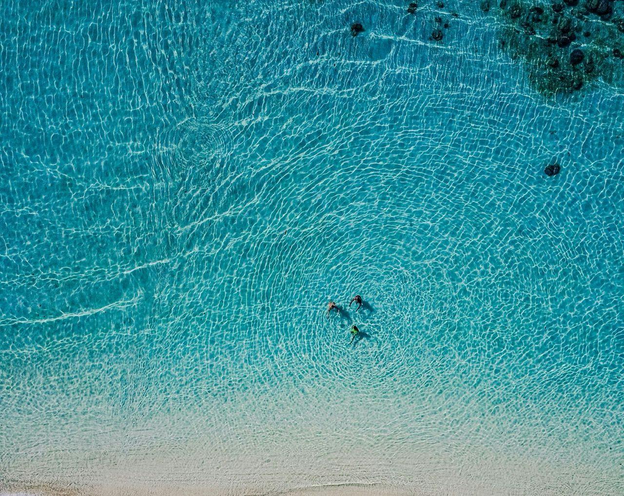 People swimming in White Beach in Boracay island.