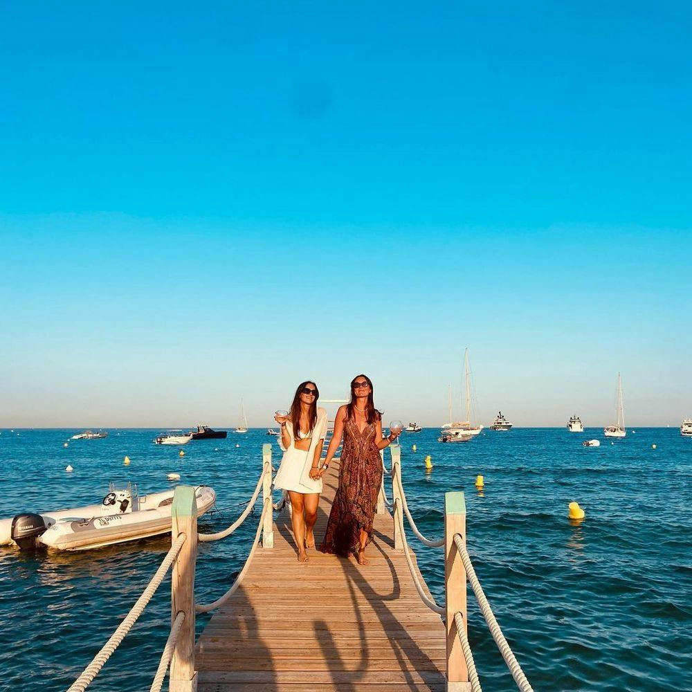 Women standing on a quay in Saint-Tropez beach club Moorea Plage