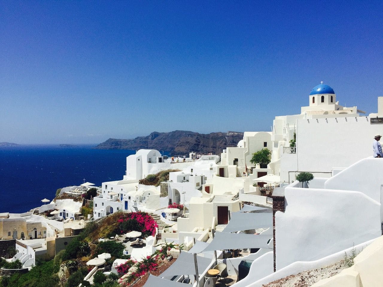 Stunning coast of Santorini with white houses and blue Mediterranean.