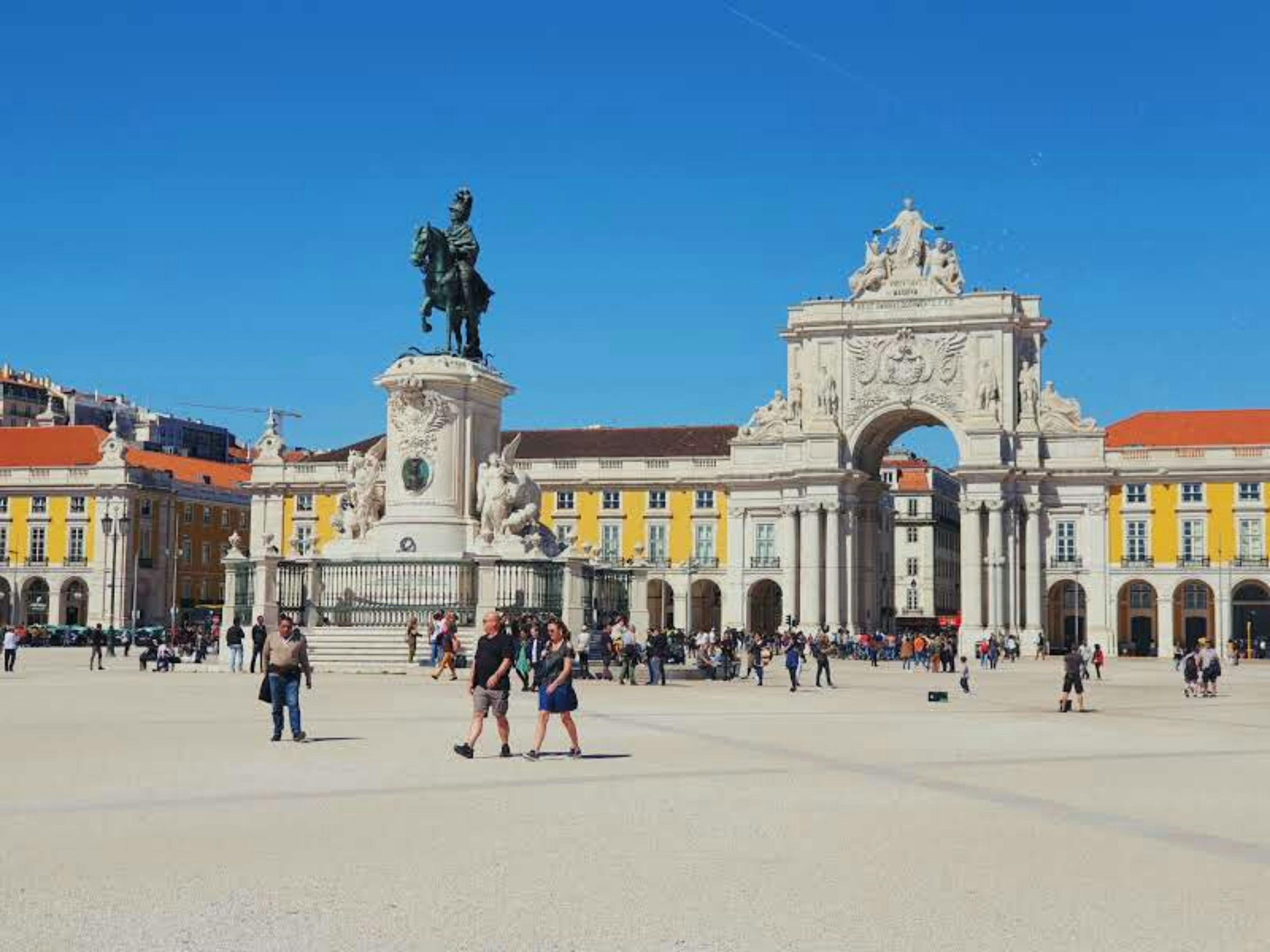 Lisbon square with people walking in Portugal