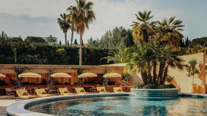 Pool and sunbeds at Le Mas Candille hotel and spa in French Riviera.