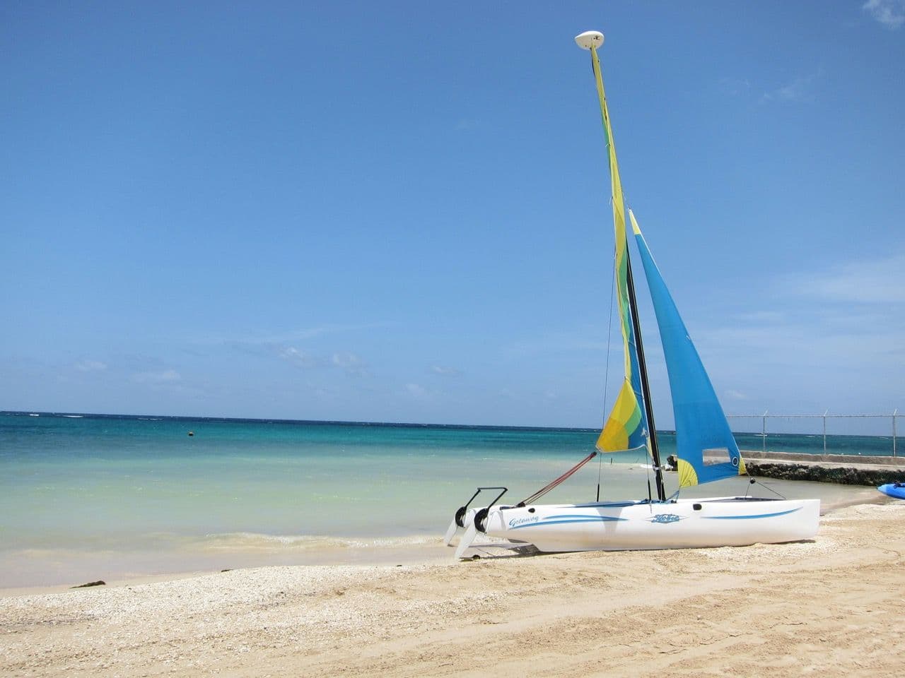 Small sailing boat on the beach in Montego Bay Jamaica.