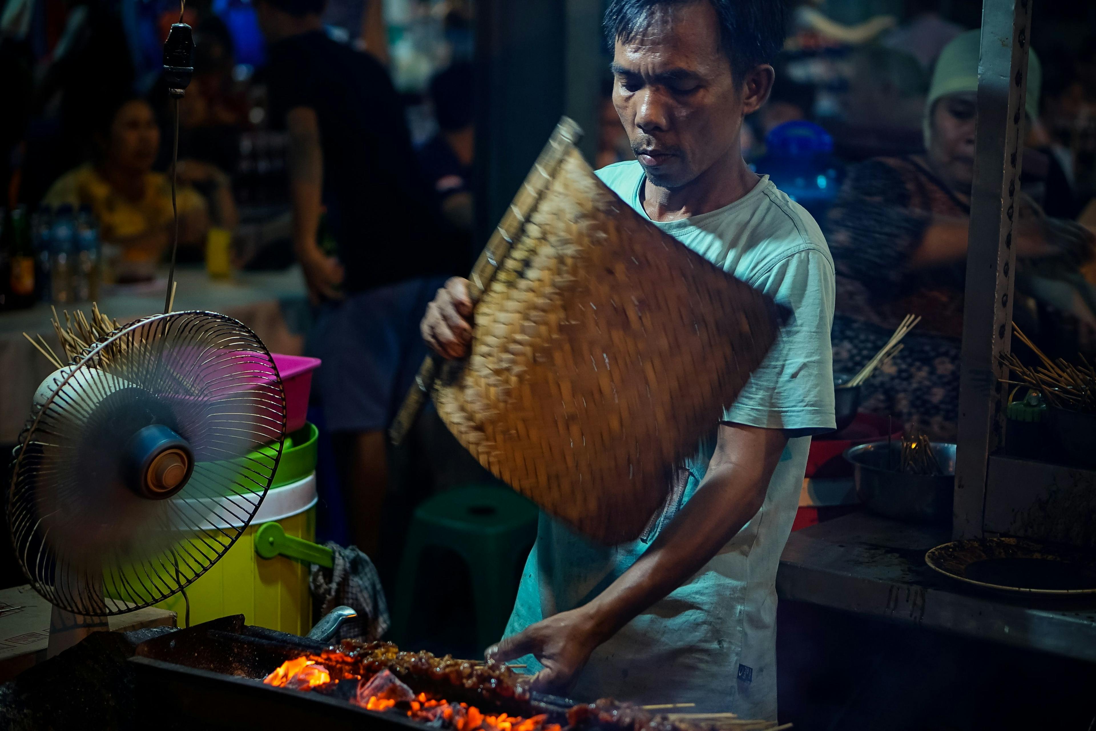 Man cooking street food in Bali.