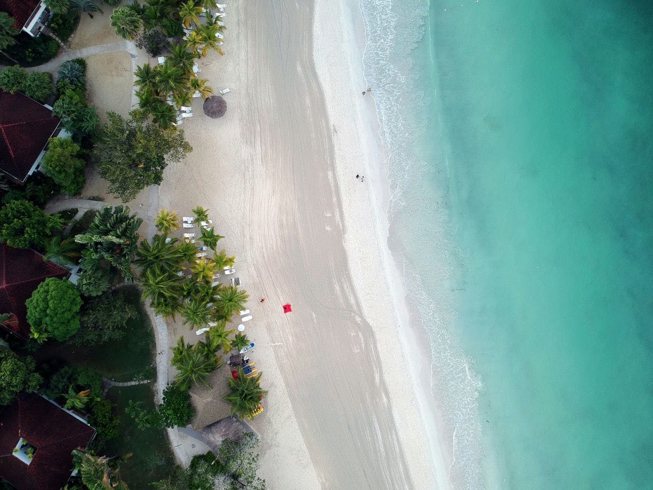 Beach with crystal clear water in Negril Jamaica.