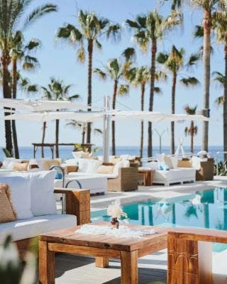 Swimming pool in Nikki Beach Marbella beach club in Costa del Sol