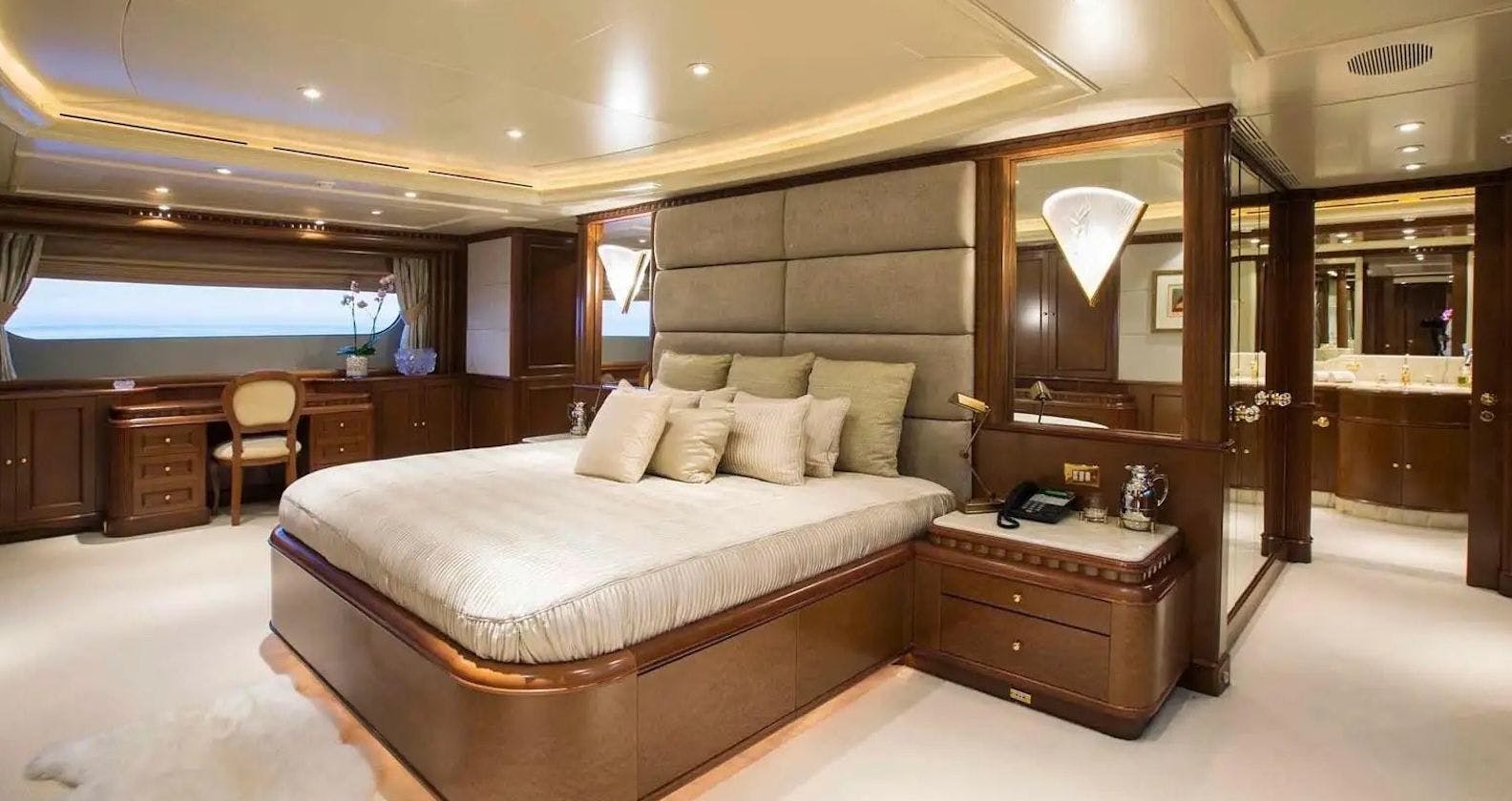 Luxurious cabin with a bed inside a motor yacht.