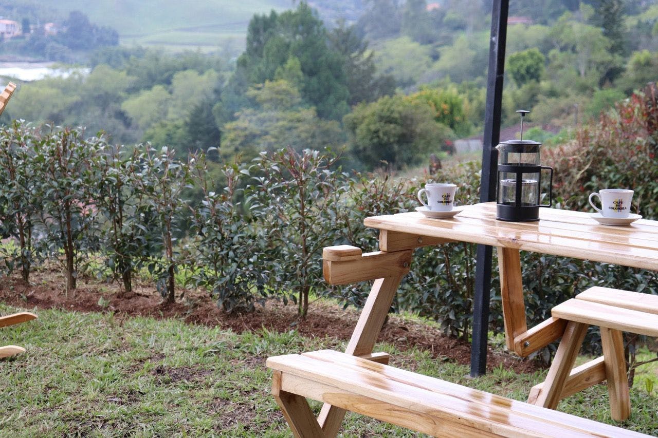 Drinking coffee in the coffee plantation in Marinilla, Antioquia.