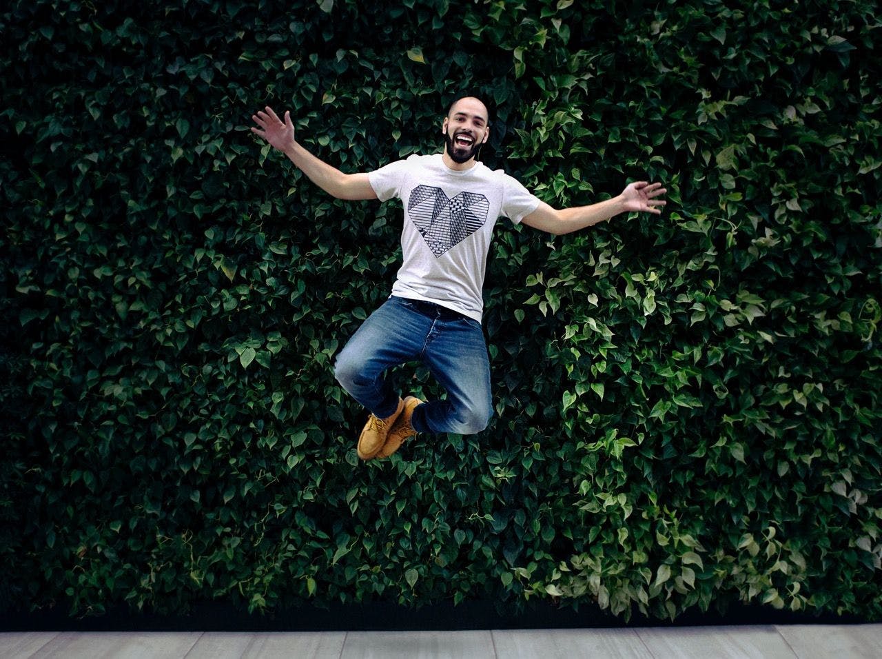 Happy man jumping on the street of Paris