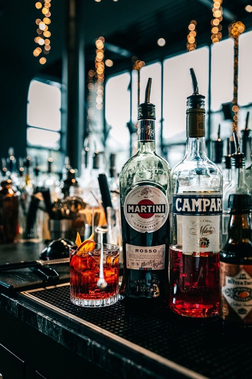 Campari and Martini bottles in a bar