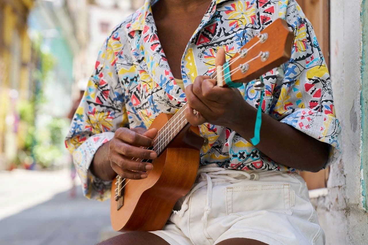 Man playing music instrument in Jamaica.