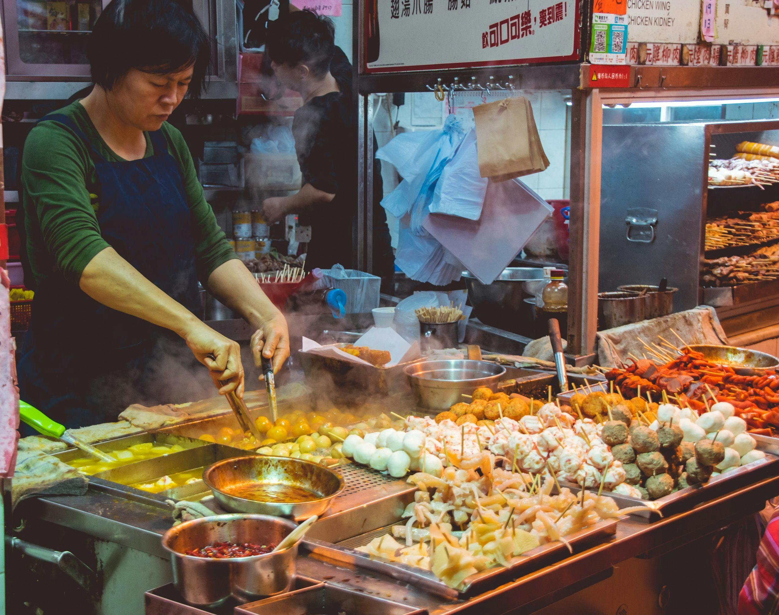 Man cooking street food in Hong Kong