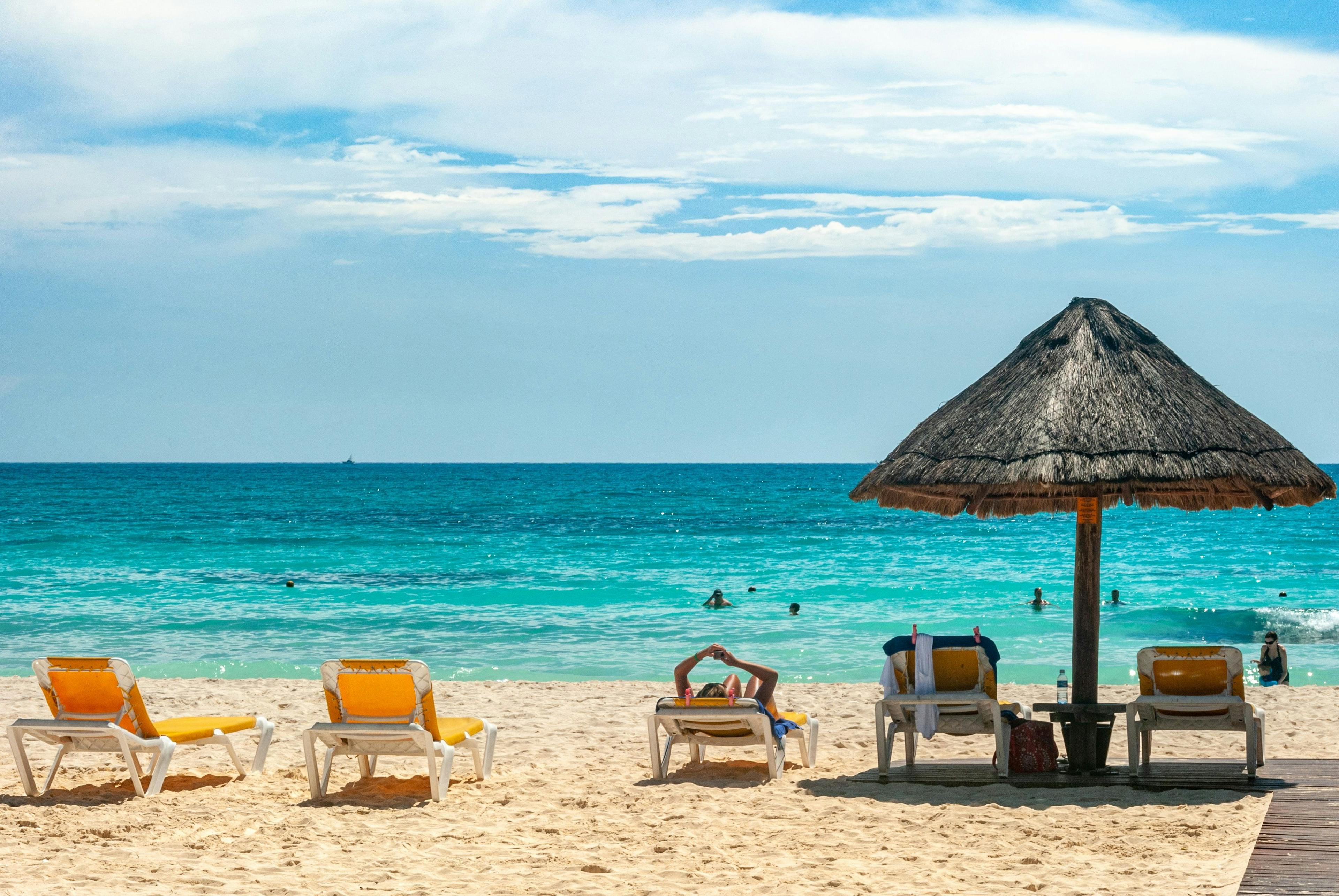 Sunbeds and umbrellas on the beach in Cancun