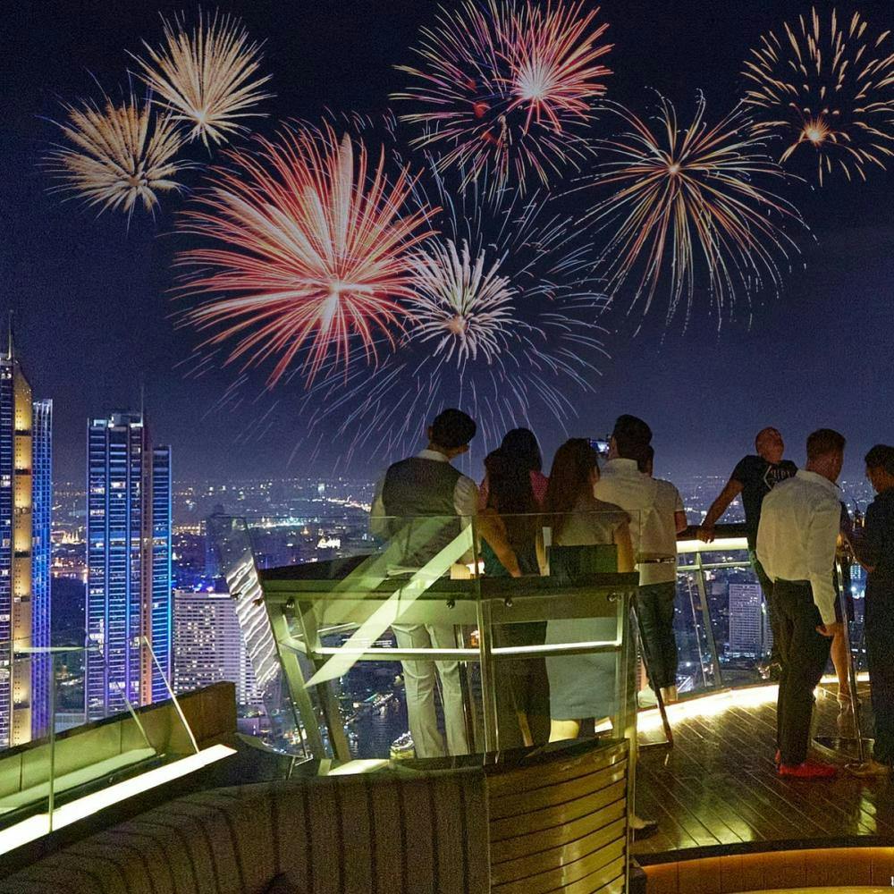 People watching New Year's fireworks in Lebua Sky Bar in Bangkok