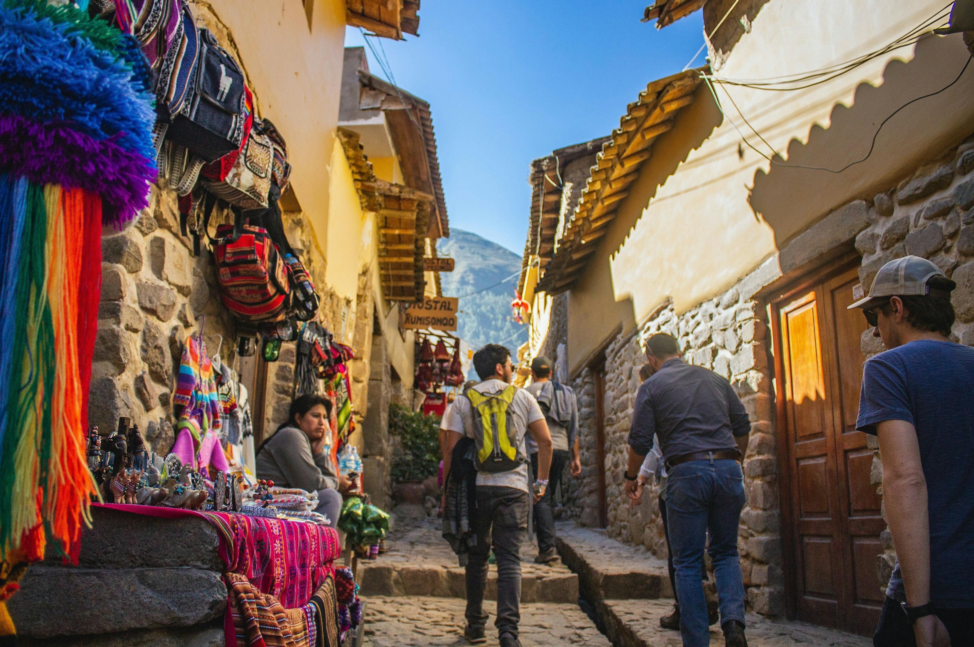Man walking on the narrow old street in Cusco Peru.