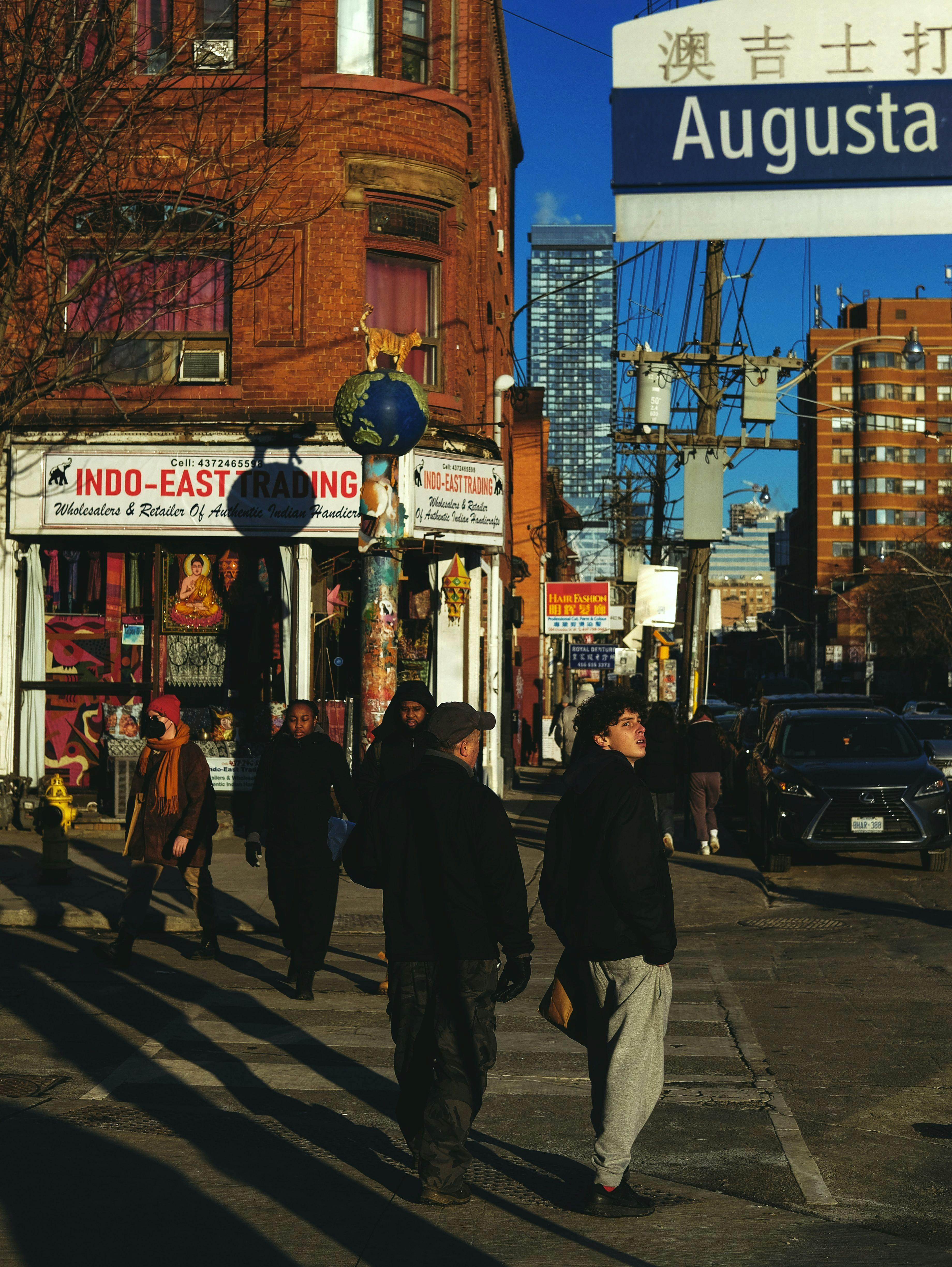 People walking in Kensington Market in Toronto.