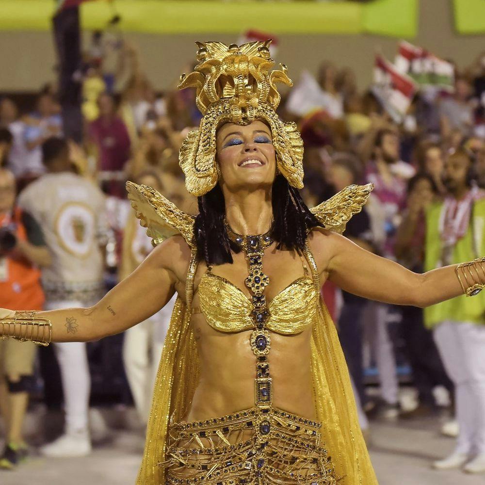 Woman in golden costume in Rio Carnival.