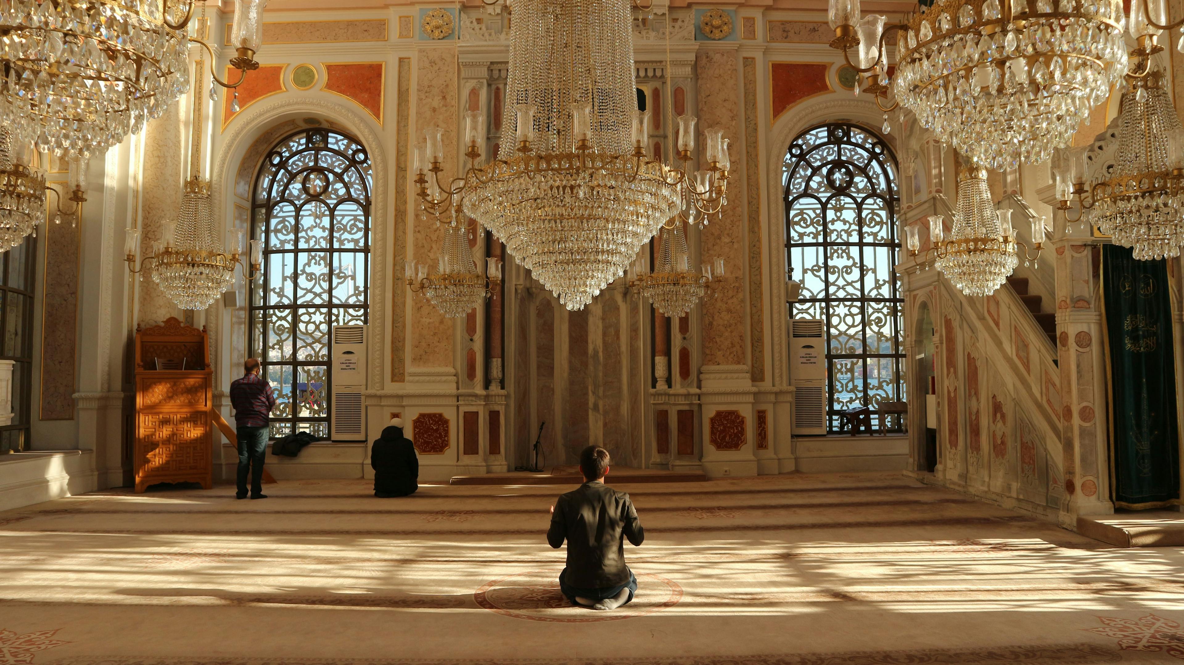 Man praying in mosque in Istanbul Turkey
