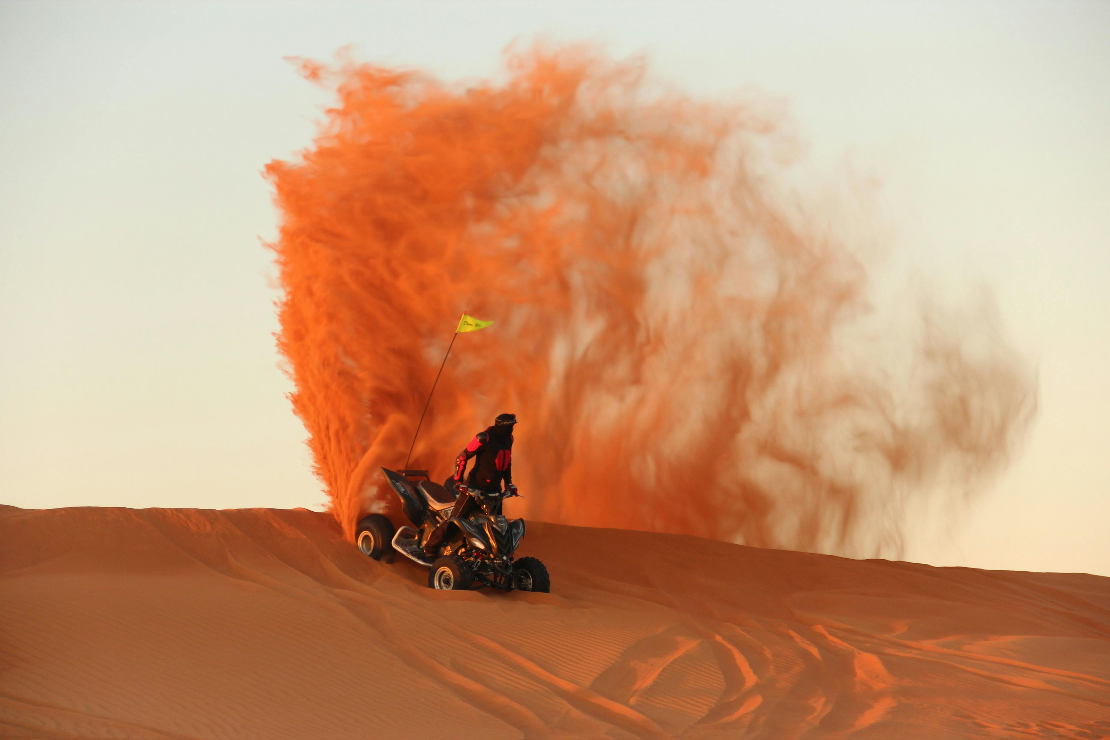 Man riding a vehicle in desert safari in Dubai
