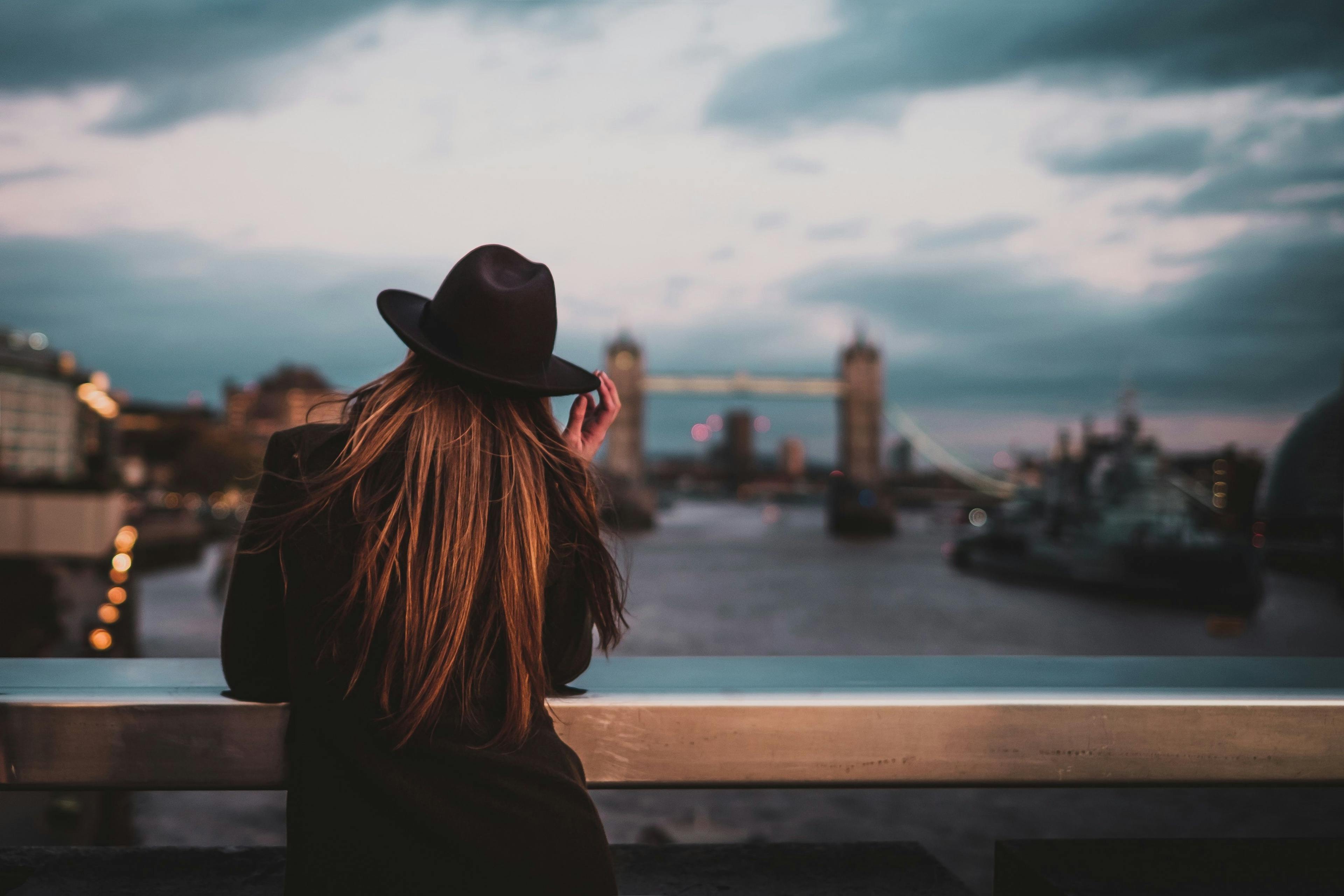 Woman looking on Thames river in London