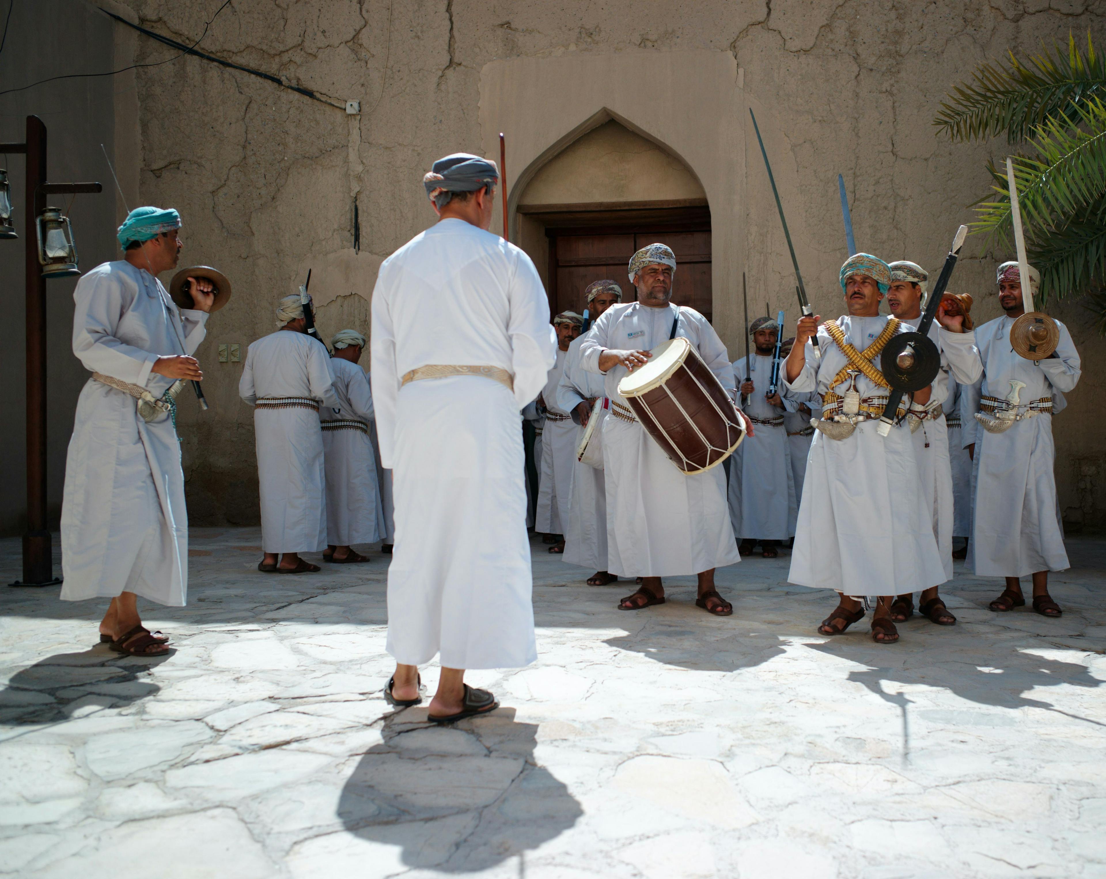 Fort guards performing ceremony in Nizwa fort Oman.