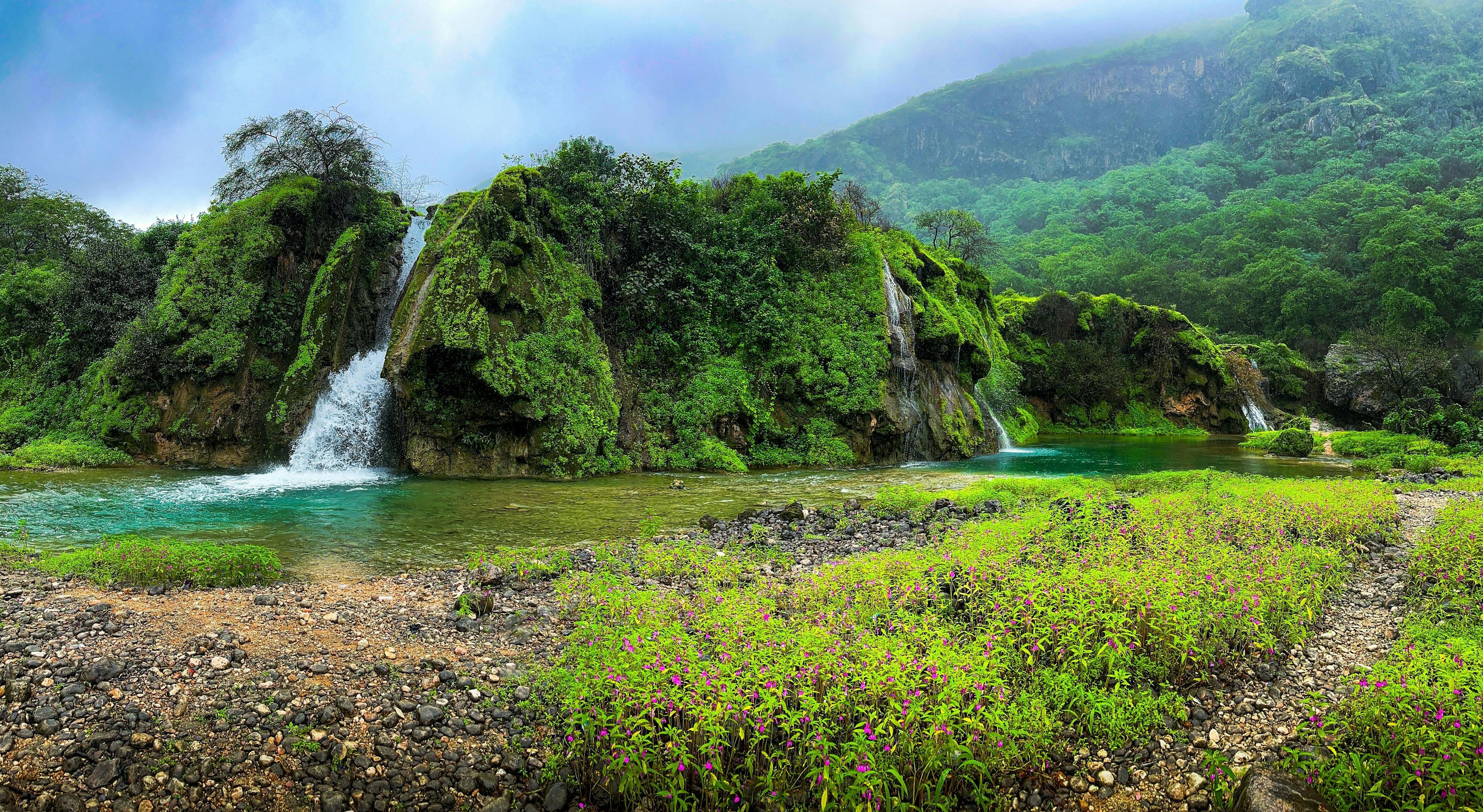 Waterfalls and lush greenery in Salalah Oman.
