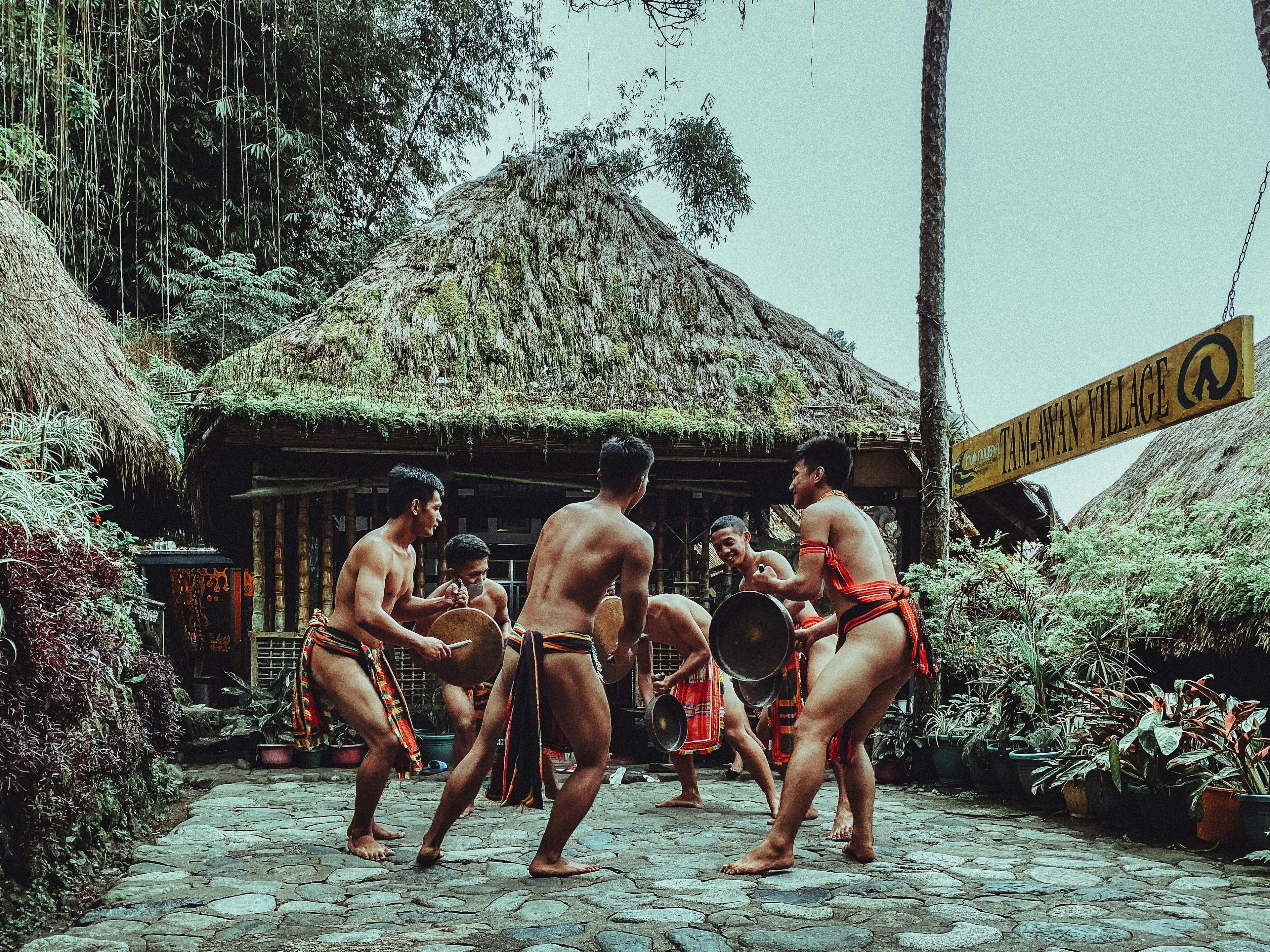 Local tribe dancing in costumes in Tam-awan Village in Benguet, Philippines.