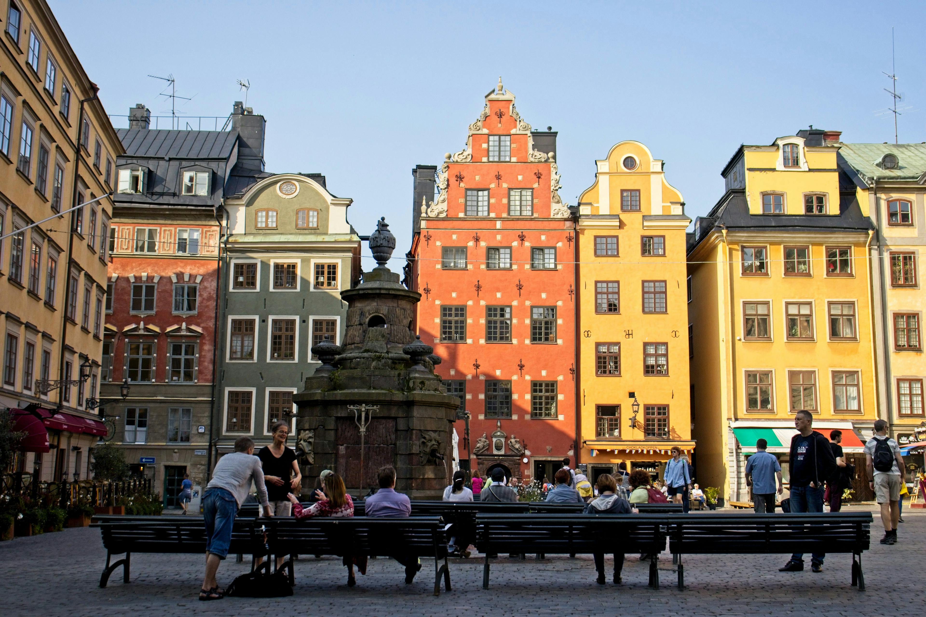 People sitting in Gamla Stan in Stockholm.