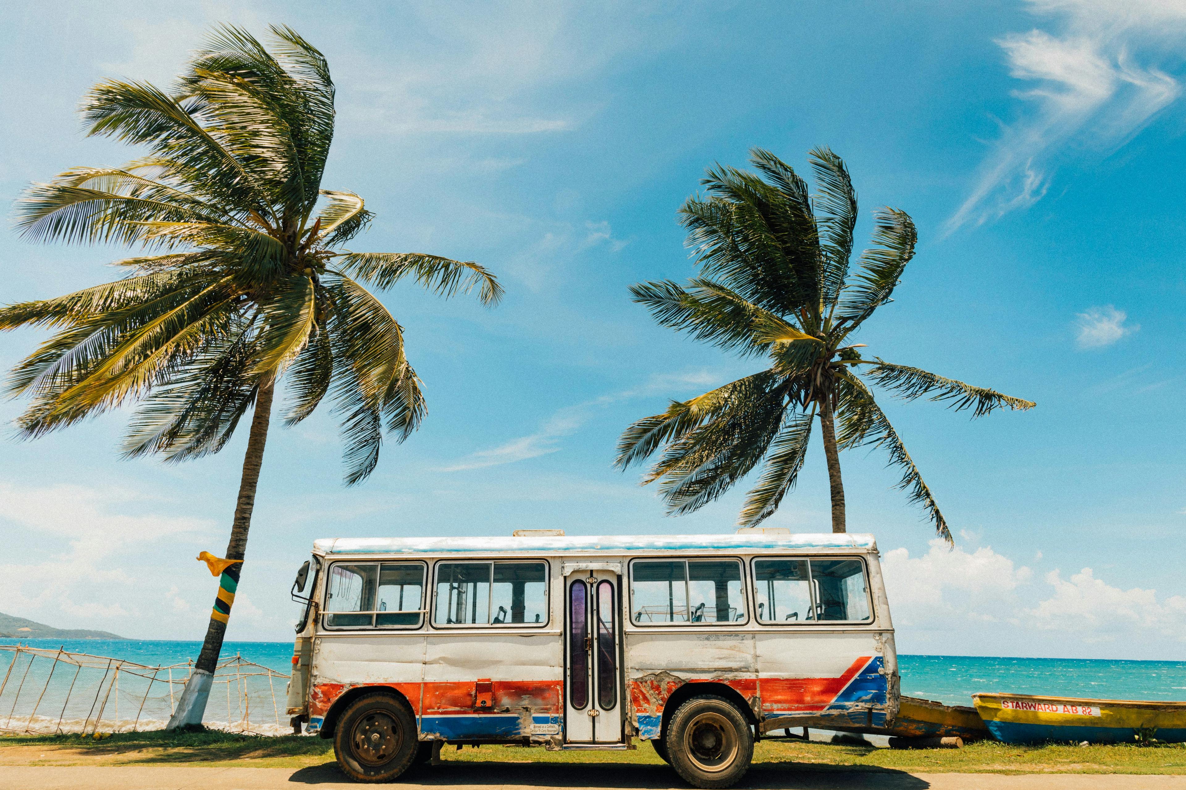 Old bus next to a beach in Jamaica.