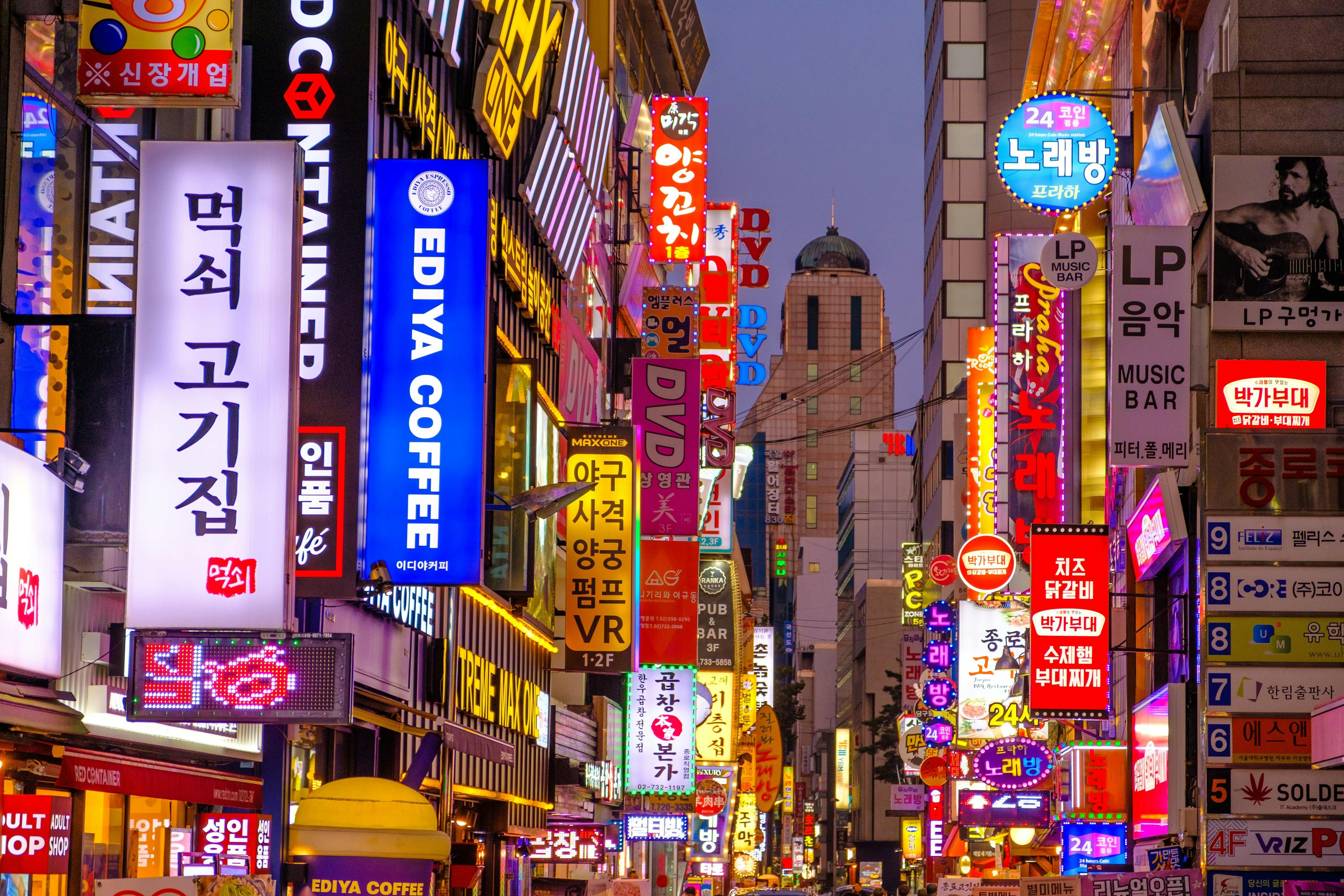 Street with bright neon lights during night in Seoul South Korea