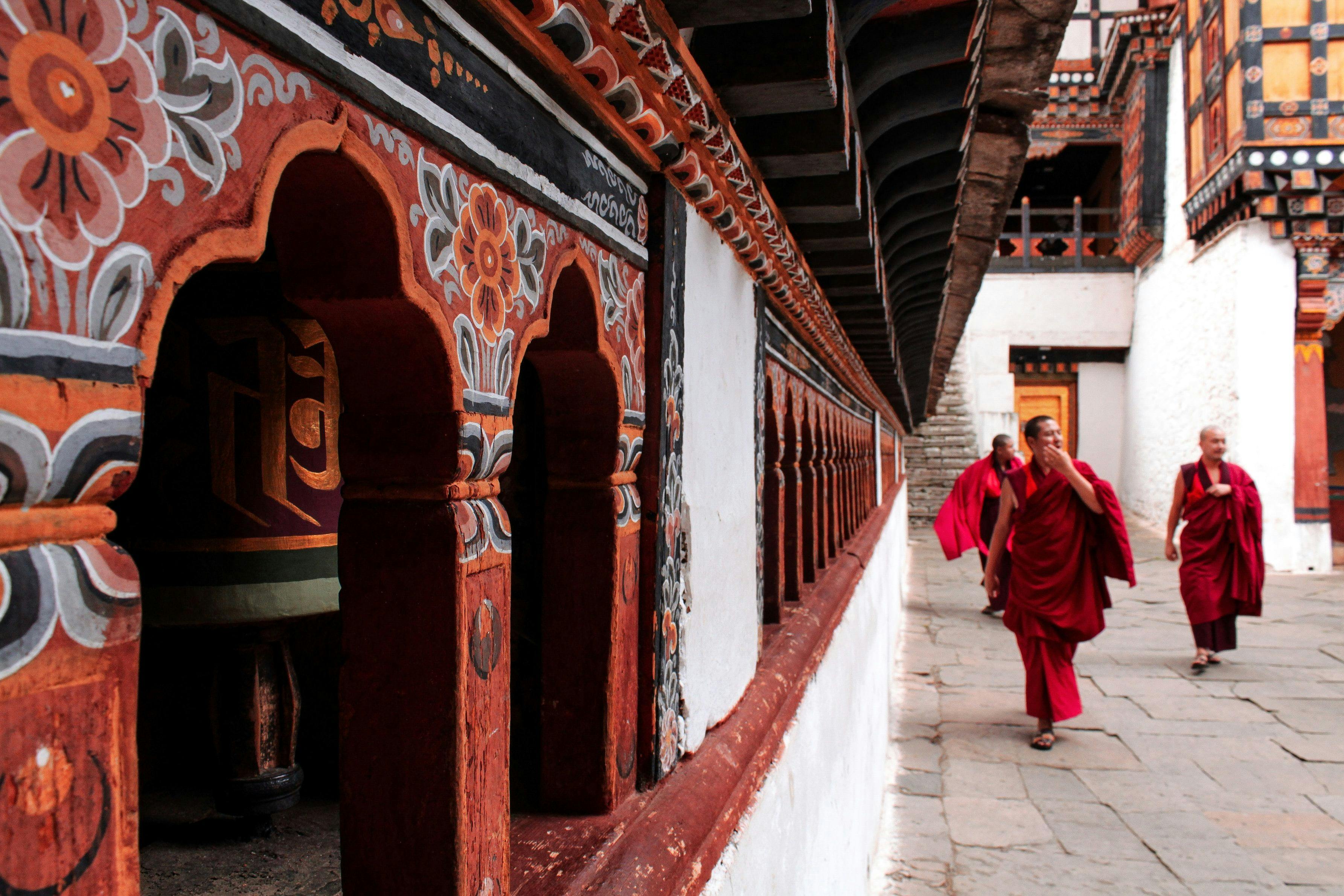 Buddhist monks walking in Paro Bhutan.