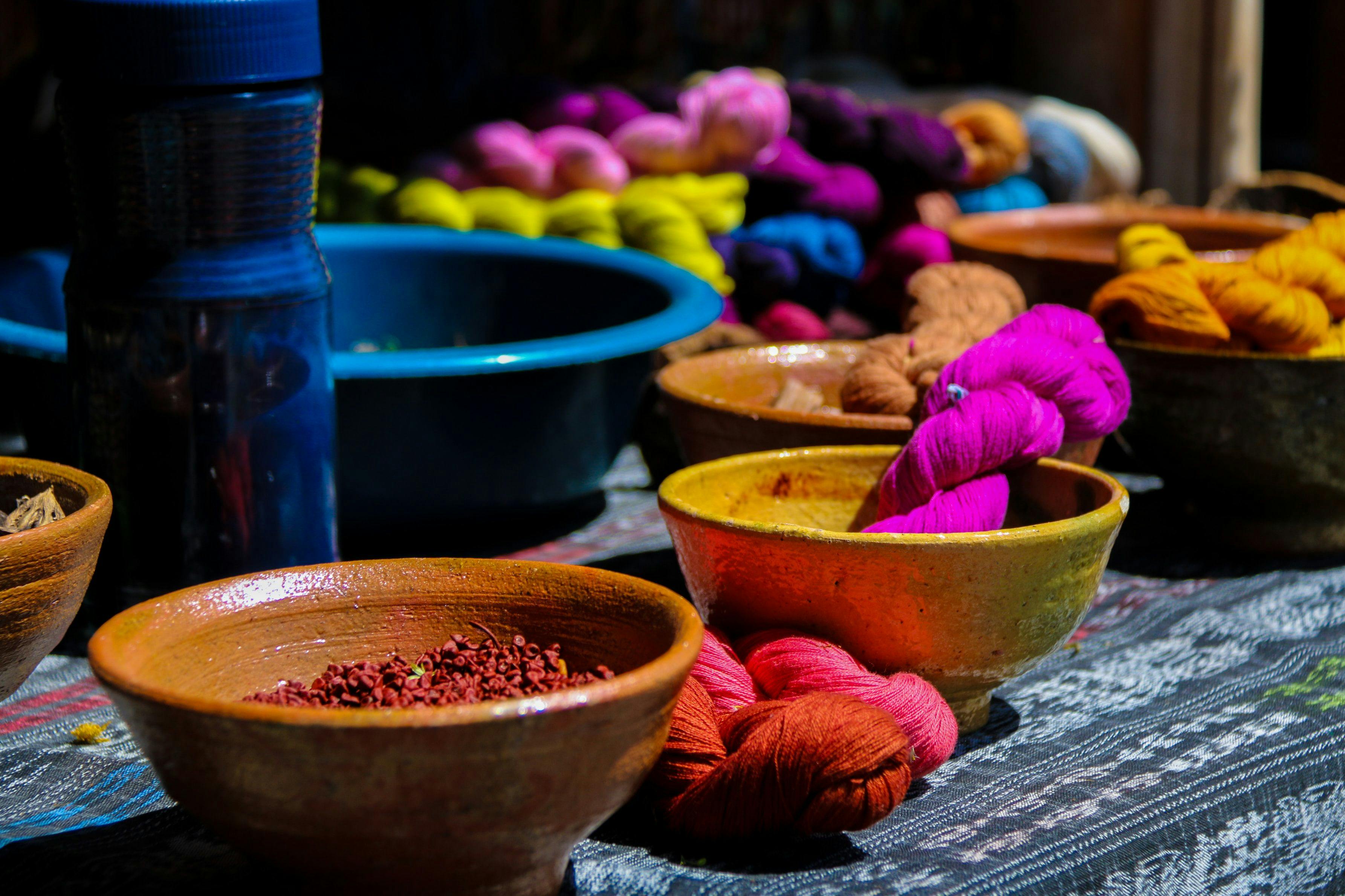 Bowls and colorful yarn on the local market in Guatemala.