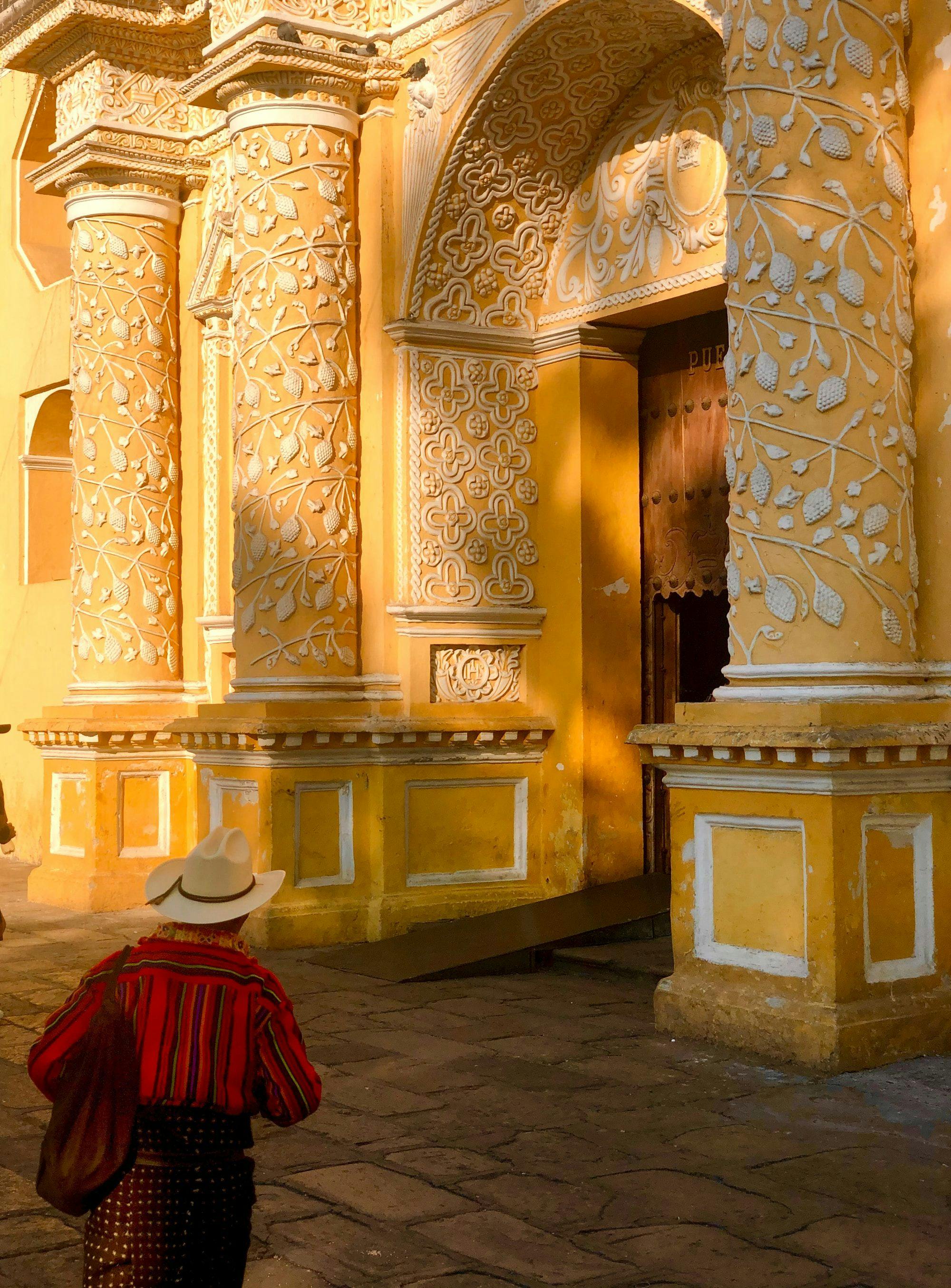 Man walking into Iglesia de la Merced, Antigua Guatemala.