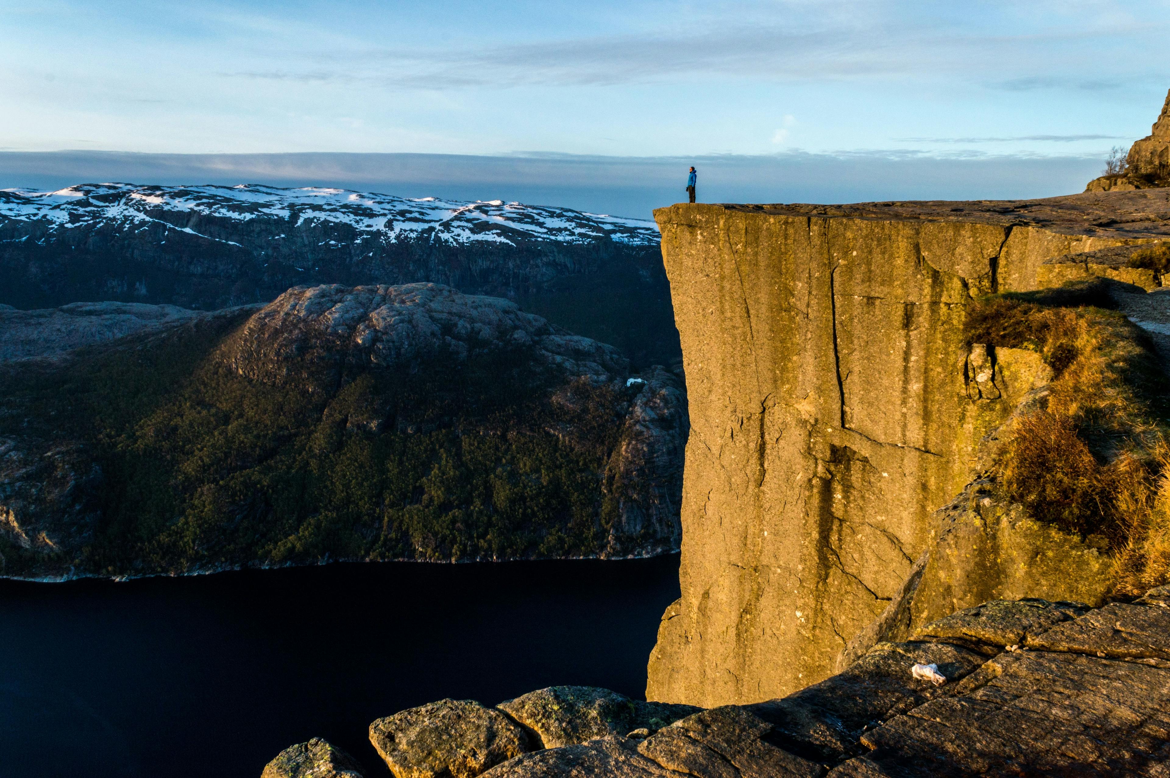 Man on the edge of Preikestolen in Norway.