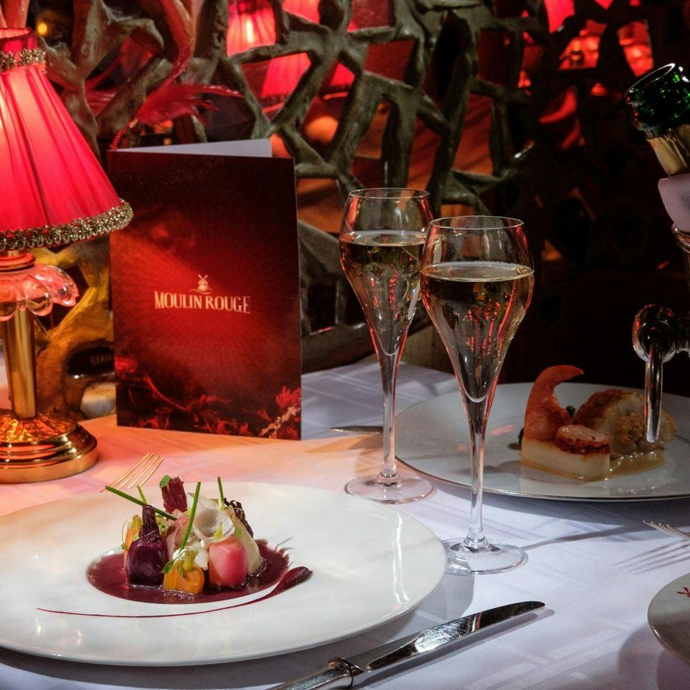 Table with food and champagne in Moulin Rouge in Paris
